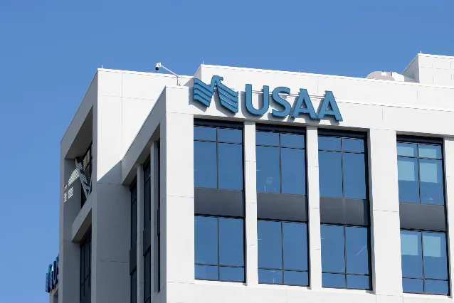USAA headquarters building with blue USAA signage against a clear sky