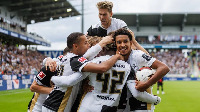 Elversberg players celebrate after scoring against Bayer Leverkusen