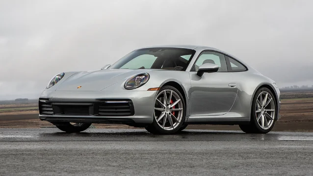 Silver Porsche 911 on a wet road