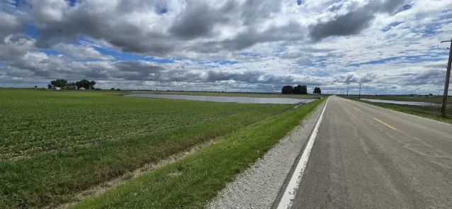 Severely flooded farm field in LaSalle County, Illinois, with standing water covering large areas after 5-6 inches of rain in 12 days