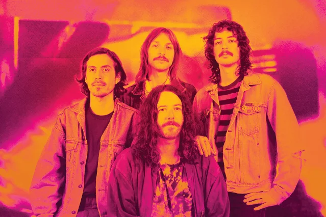 GO MAHHH band photo — four members, pink-orange filter