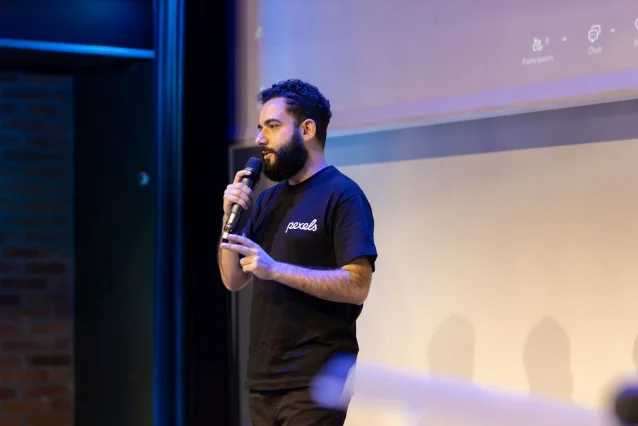 A speaker at a live technology conference event on stage