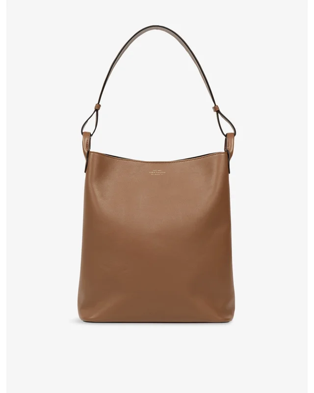 Tan leather Smythson hobo-style shoulder bag with a single strap, photographed against a pale ground
