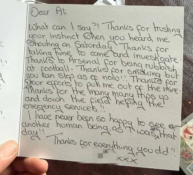 A handwritten thank-you card photographed as it is held in a hand