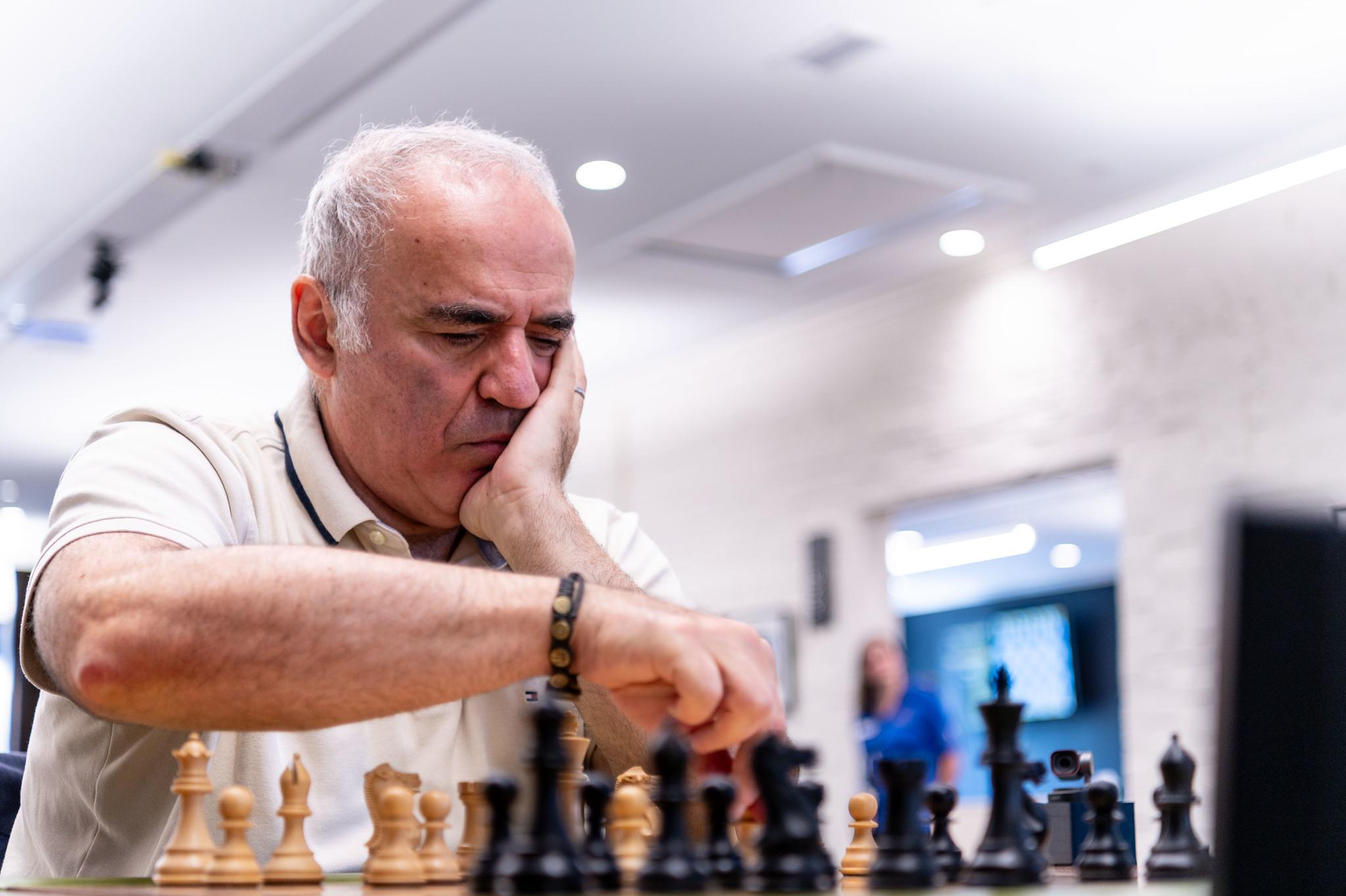 Garry Kasparov concentrating over a chessboard