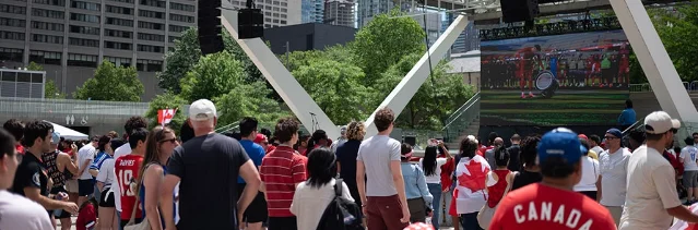 Fans watch a soccer broadcast at Nathan Phillips Square