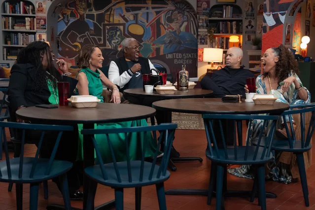 The returning cast of A Different World in a cafe scene