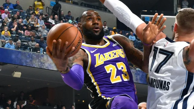 LeBron James drives toward the basket during a Lakers game