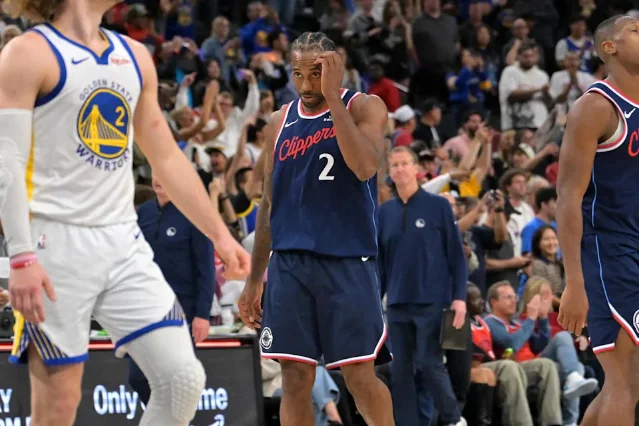 LA Clippers forward Kawhi Leonard walks past Golden State during a game.