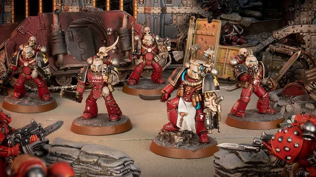 Horus Heresy era Word Bearers Space Marines in their dark red plate armour