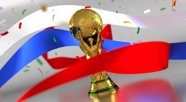 A World Cup trophy replica against a confetti backdrop — what both restaurants are ultimately chasing