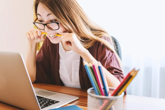 Graduate student studying on a laptop — preparing a PhD application