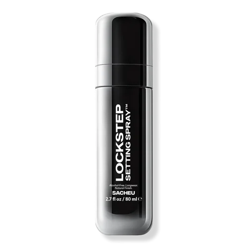 SACHEU LOCKSTEP Setting Spray — silver-black cylindrical bottle, 2.7 fl oz, labeled "Alcohol-Free. Longwear. Natural Finish" and "SACHEU"