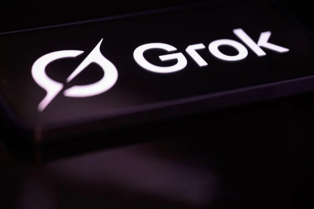 A SpaceX Grok logo displayed on a mobile phone screen against a dark background