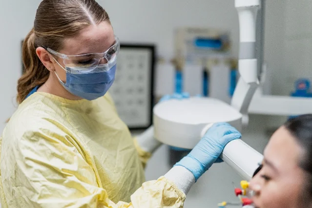 A dental student provides care at the University of Saskatchewan College of Dentistry.