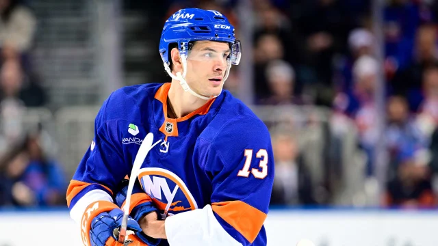 New York Islanders forward Mathew Barzal looking on during a game