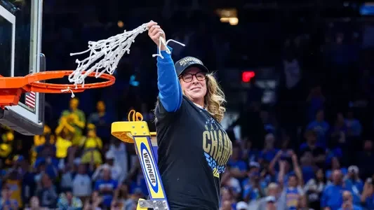 Cori Close cuts the net after UCLA's first women's basketball national championship, April 5, 2026