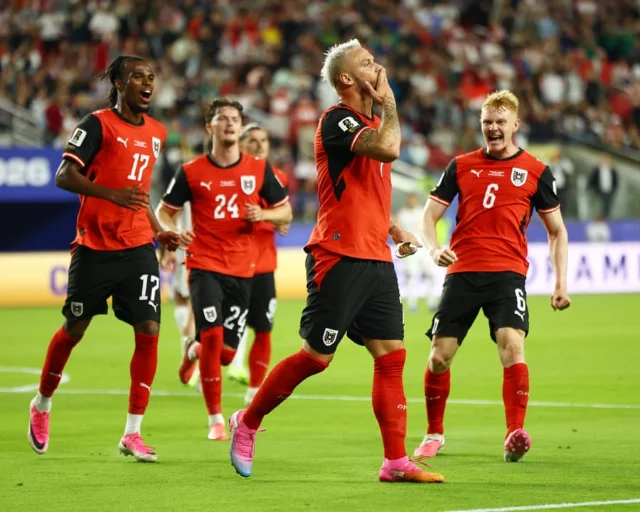 Marko Arnautovic celebrating after converting Austria's late penalty against Jordan