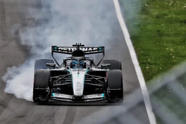 George Russell's Mercedes stopped on track with smoke from locked tyres after his power unit failure