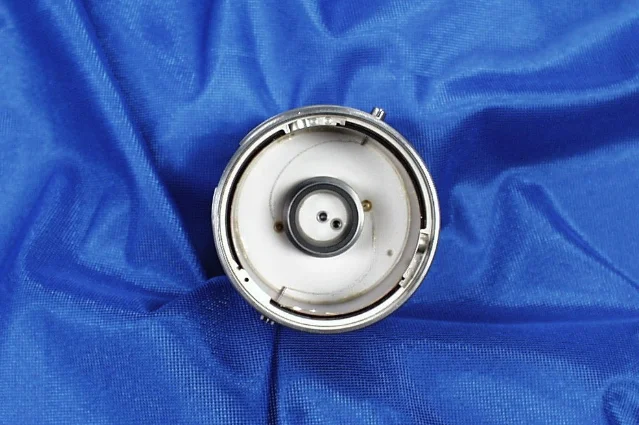 A close-up showing Hubble gyroscope flex leads — the hair-thin metal wires that carry power and telemetry through the spinning gyro assembly, visible here coiled near the gyro housing