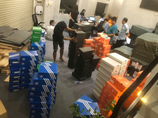 Rows of counterfeit branded shoes seized at the Long Truong Ward warehouse, HCMC