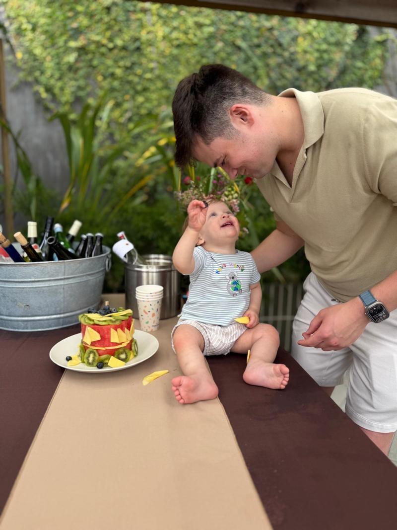 Sam Altman at a birthday party with his toddler, included in the post as a personal appeal
