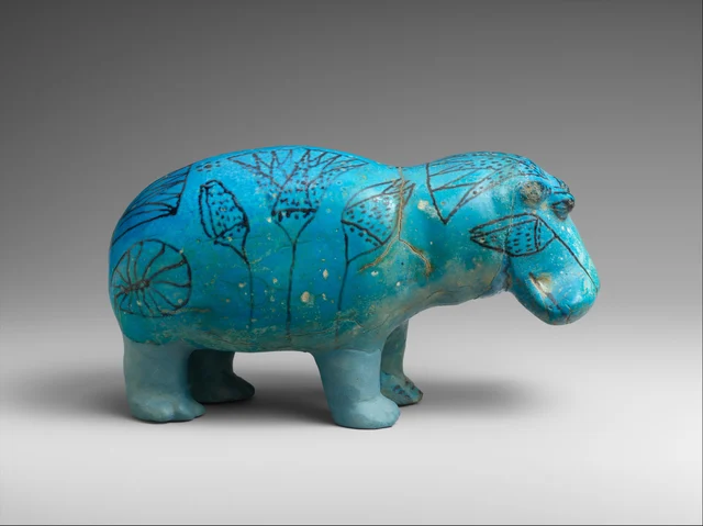 William viewed from the left side, showing lotus flowers, papyrus buds, and leaf motifs in black manganese on vivid blue-green faience