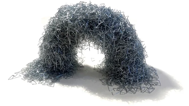 A free-standing arch structure assembled from hundreds of interlocked galvanized metal staples, photographed on a white background