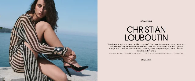 Christian Louboutin now online at Bloomingdale's banner — woman in striped dress with red-sole black heels seated by the water