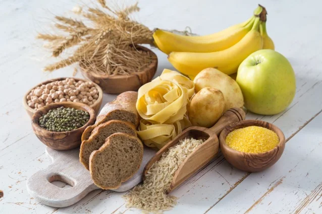 Assorted whole-food carbohydrates on a work surface