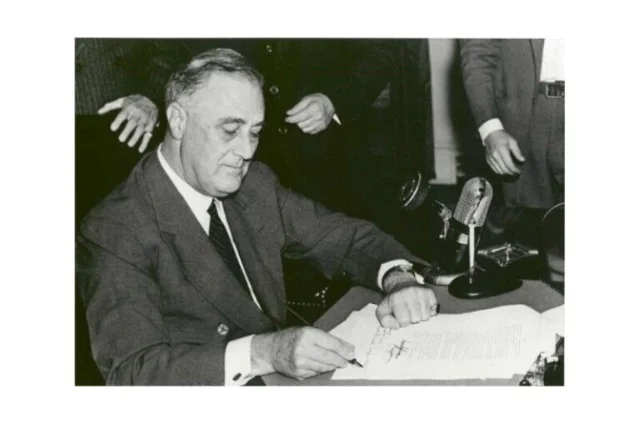 FDR signs the Federal Credit Union Act, June 26, 1934