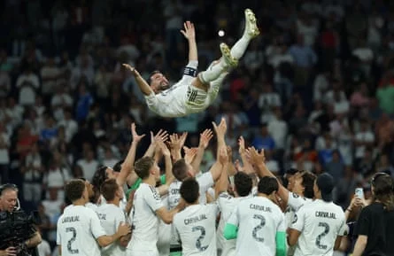 Dani Carvajal is lifted by Real Madrid teammates at the Bernabéu in his farewell moment