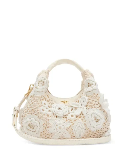 GANNI ivory floral crochet mini tote bag with top handles and a crossbody strap, from Farfetch's SS26 sale