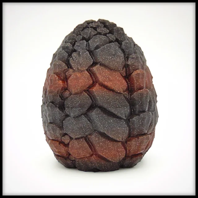 Fully closed Stone Crawler Dragon Egg — stone fragment texture, dark grey with red-brown shimmer