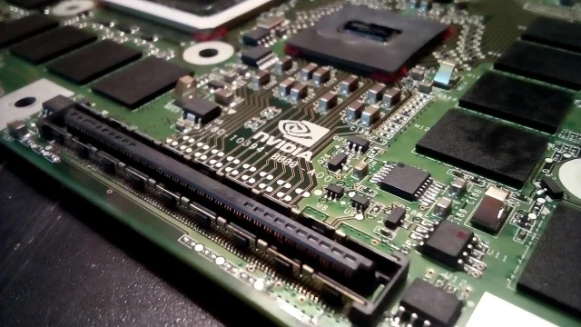 Nvidia GPU PCB with the green eye logo visible on the circuit board
