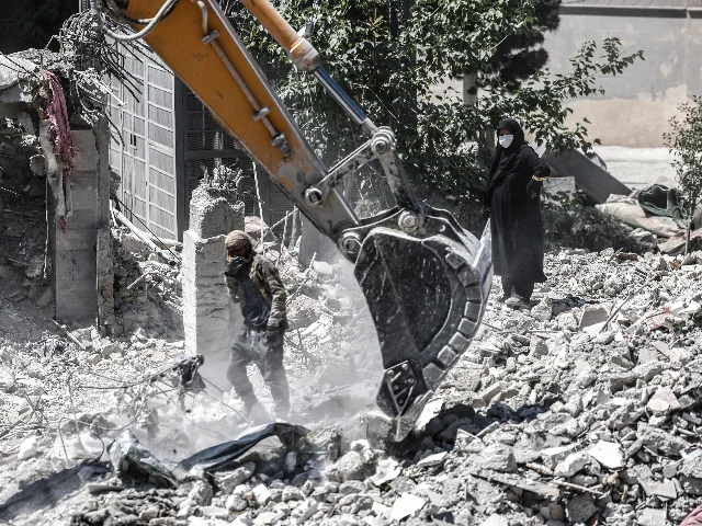 Residents near destroyed buildings in Tehran, June 7, 2026 (Majid Asgaripour/WANA via Reuters)