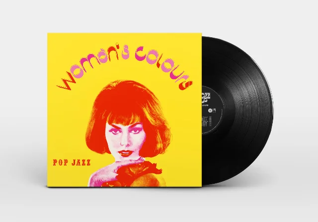 Woman's Colours LP with vinyl disc — yellow cover and black record partially revealed against a grey background