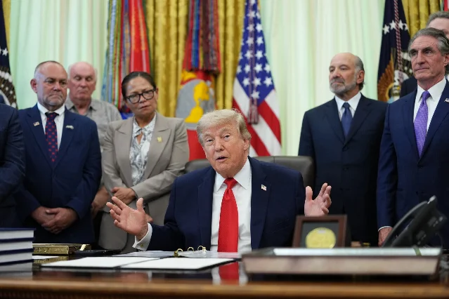 Trump speaking at the Oval Office on June 11, 2026, announcing a "great settlement" with Iran