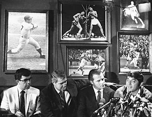 Sportscasters Pat Summerall and Frank Gifford listen as Joe Namath announces his retirement at Bachelors III, June 1969