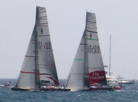Alinghi SUI-100 and Emirates Team New Zealand NZL-92 race off Valencia
