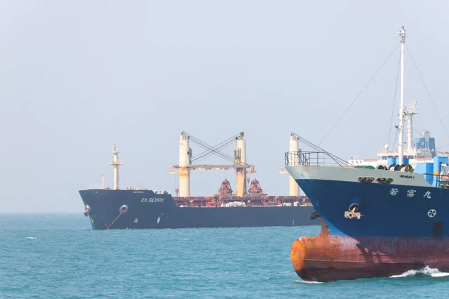 Commercial vessels anchored in waters near the Strait of Hormuz, May 4, 2026