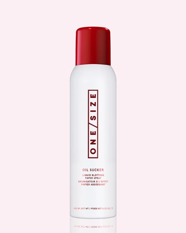 ONE/SIZE Oil Sucker Liquid Blotting Paper Spray, full-size 4.22 oz aerosol can with white body and red cap, labeled "Oil Sucker Liquid Blotting Paper Spray" — Patrick Starrr's signature oil-control spray. Via onesizebeauty.com.