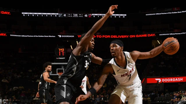 Miami Heat guard attacks against the San Antonio Spurs in California Classic play