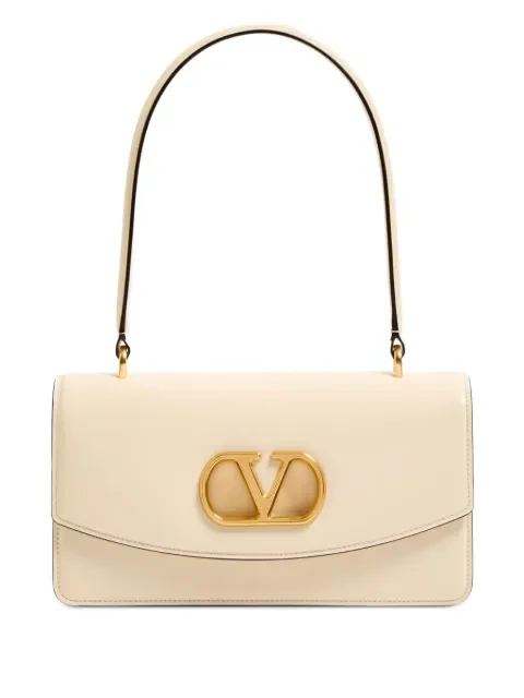 Valentino Garavani Vain tote bag — black structured leather tote on white product background, Farfetch SS26 sale price $2,140 (from $5,704)