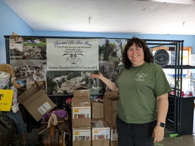 Carol Ritchie in front of the rescue shop
