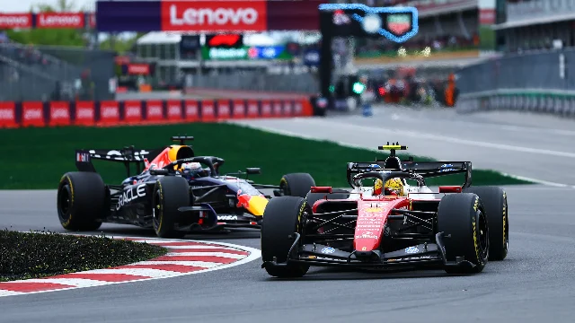 Lewis Hamilton in Ferrari SF-26 in wheel-to-wheel battle with Verstappen at Turn 1