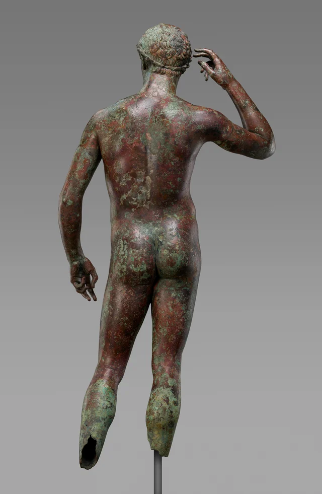 The back of the Victorious Youth, showing the rectangular neck support plate — a manufacturing feature shared with the Marathon Boy and the Antikythera Youth