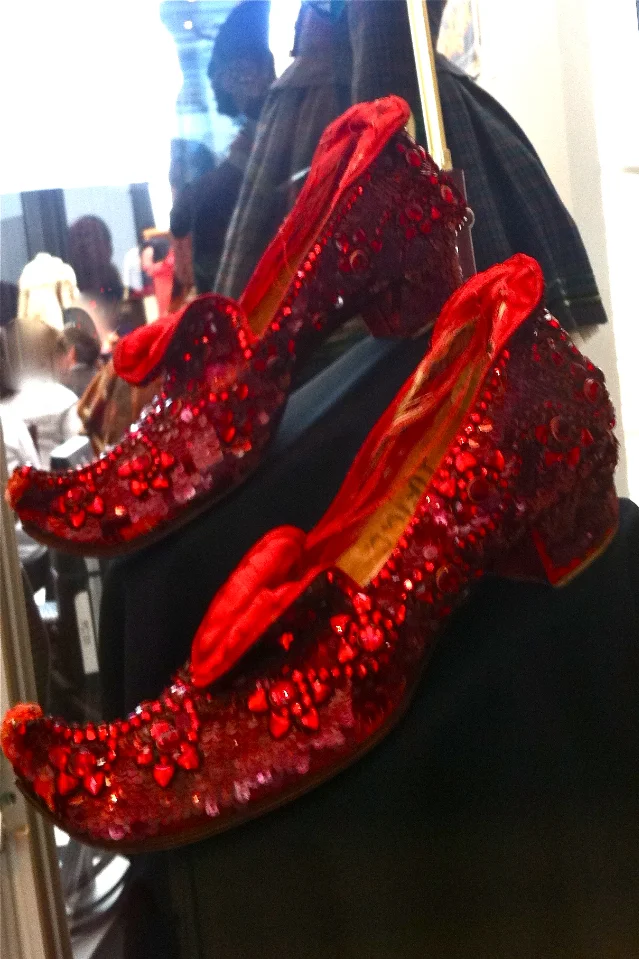 The 'Arabian test pair' — Adrian's rejected first ruby slipper design, with curled toes and elaborate jeweled ornamentation. Previously owned by Debbie Reynolds.