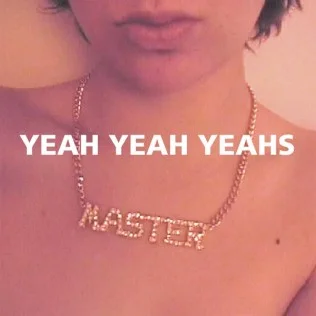 The cover of the Yeah Yeah Yeahs EP, showing the cropped face and the necklace that reads "MASTER"