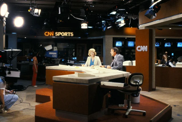 Dave Walker and Lois Hart anchor CNN's first broadcast on June 1, 1980, in the sports studio at the Atlanta facility
